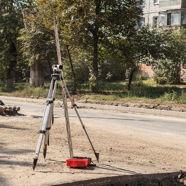 Building surveying equipment theodolite level tool during the repair of the roadway. Tula region, Russia